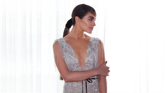 olivia culpo silver dress Olivia Culpo struggles to sit down in her sparkly mini dress